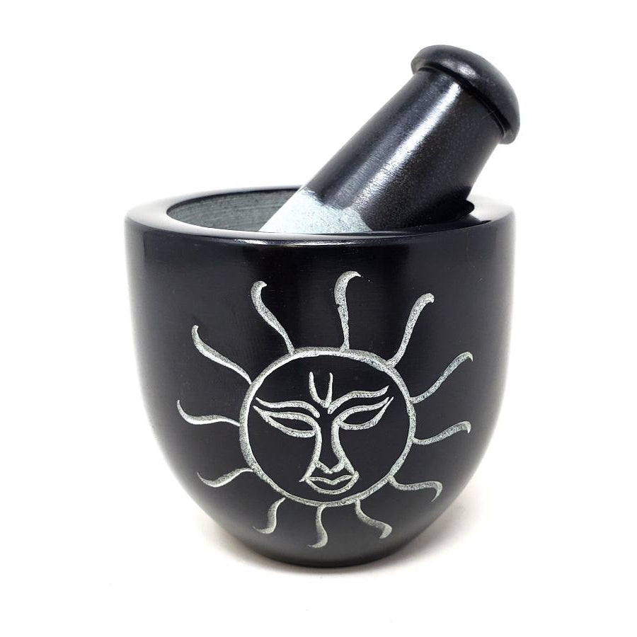 http://magick.com/cdn/shop/files/3-Sun-Carved-Black-Soapstone-Mortar-Pestle.jpg?v=1691716968