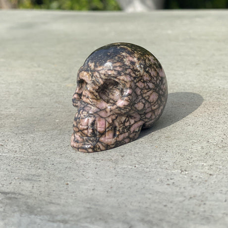 Natural Rhodonite Hand Carved Small Skull B - .24 lbs (2 x 1.25 x 1.5 inches) - Magick Magick.com