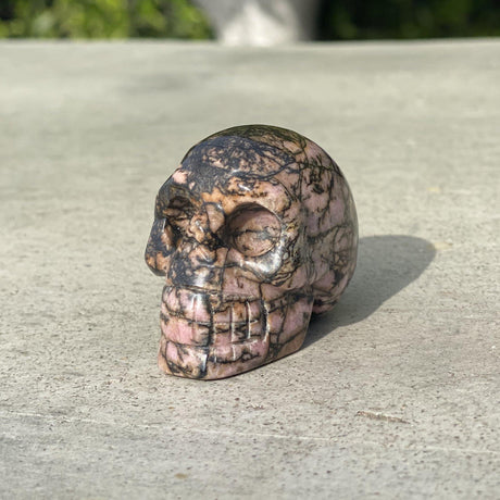 Natural Rhodonite Hand Carved Small Skull C - .24 lbs (2 x 1.25 x 1.5 inches) - Magick Magick.com